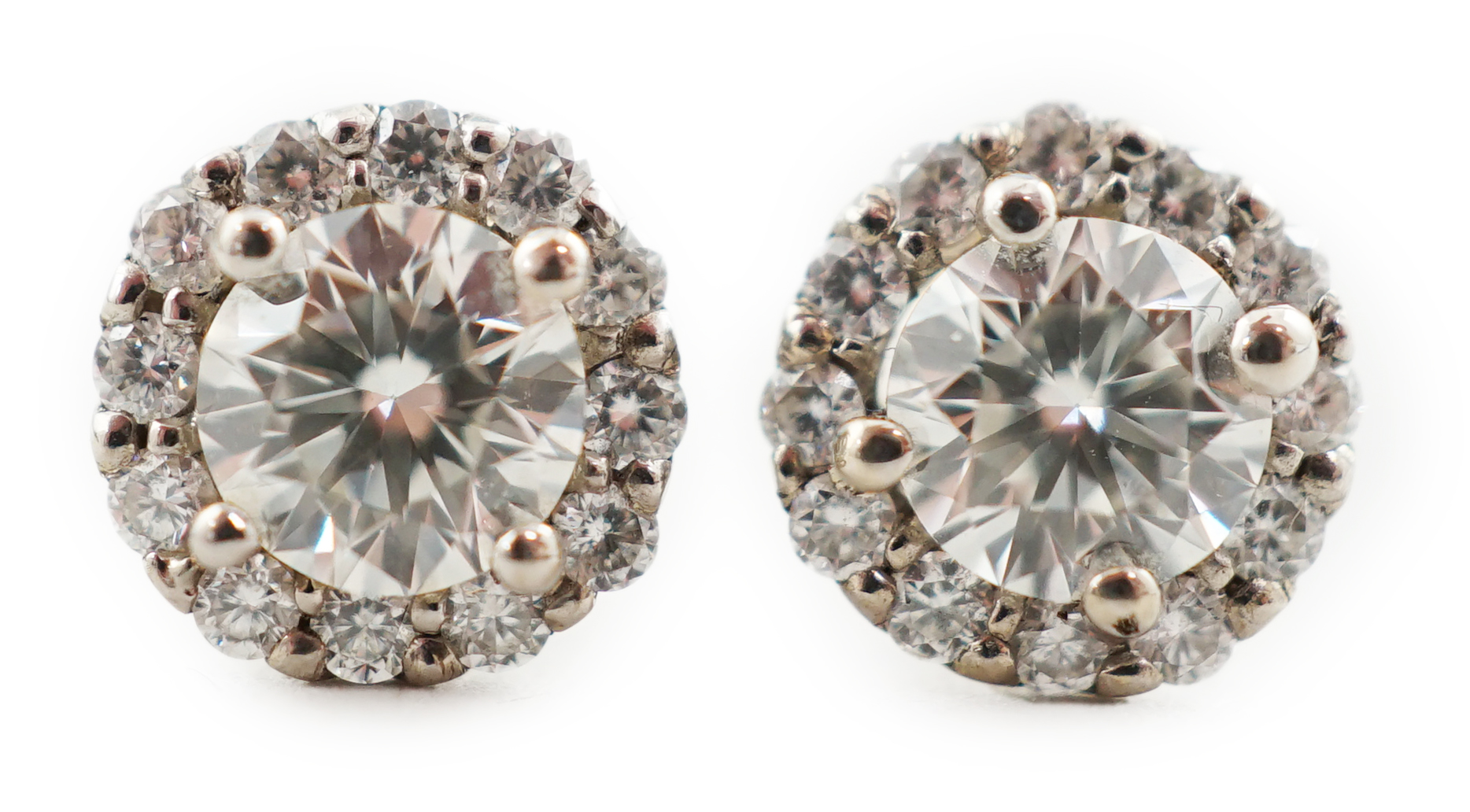 A modern pair of 18ct white gold and diamond cluster set ear studs